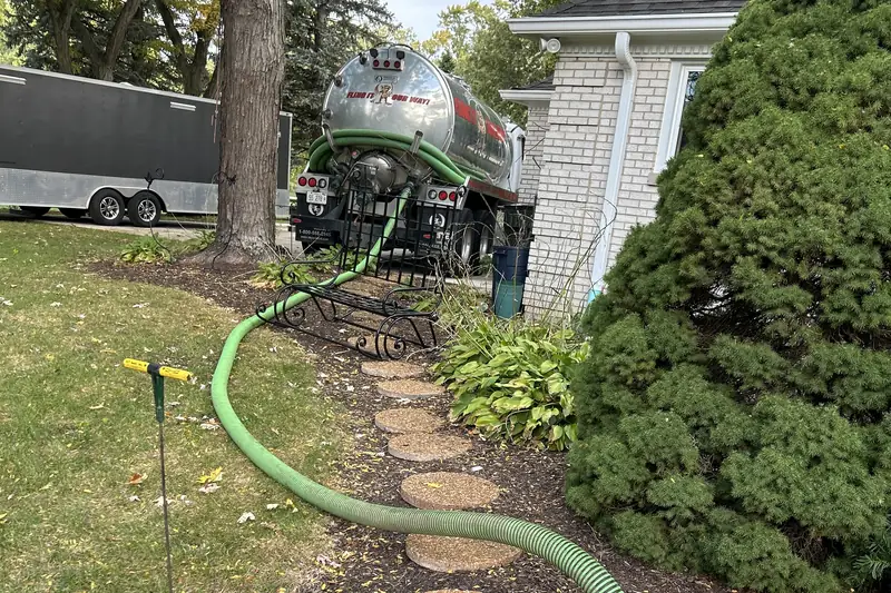 Hose run carefully along a stepping-stone path through landscaping