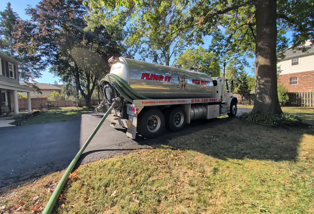 Ability Septic tanker on a driveway — FLING IT OUR WAY lettering